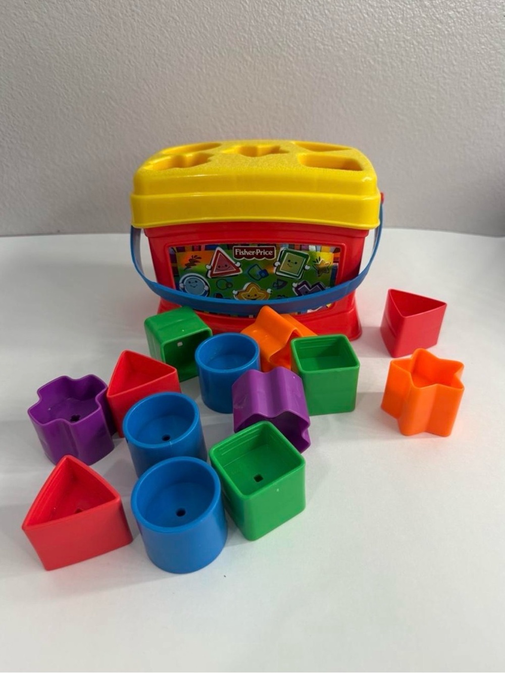 Fisher-Price Red & Yellow Shape Sorting Bucket with Multi-Color Shapes